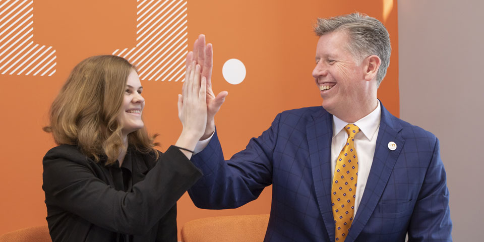 Student High-Fiving President Einolf